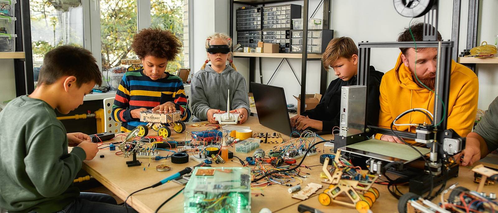 Young technicians building robots and vehicles