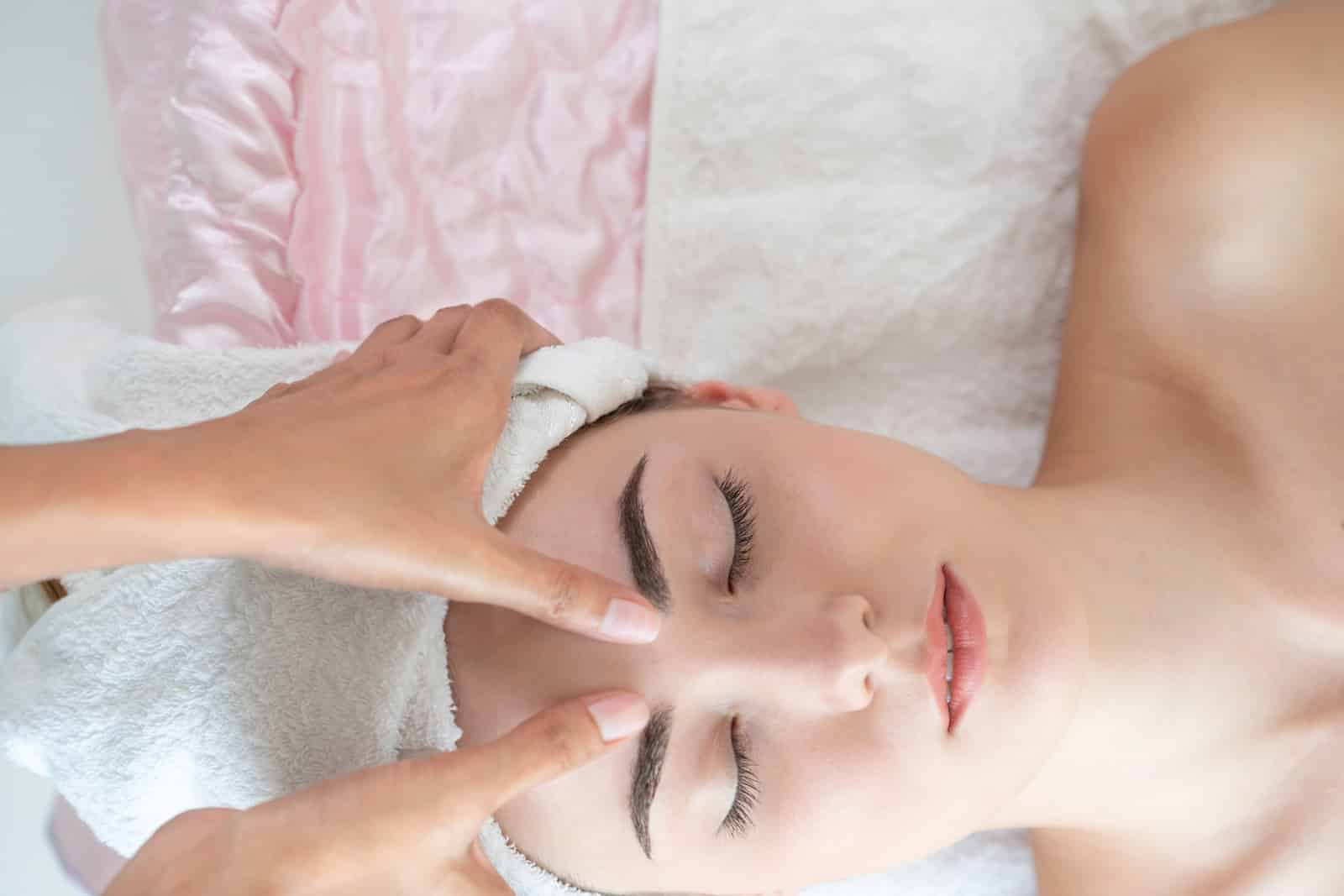 Relaxed woman lying on spa bed