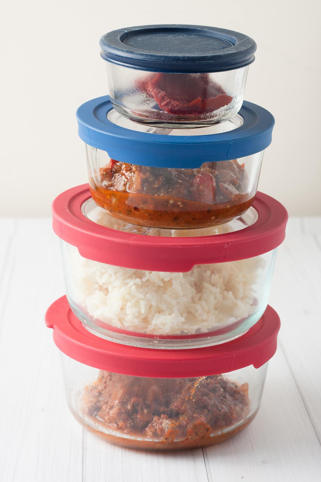 stack of glass containers with leftovers