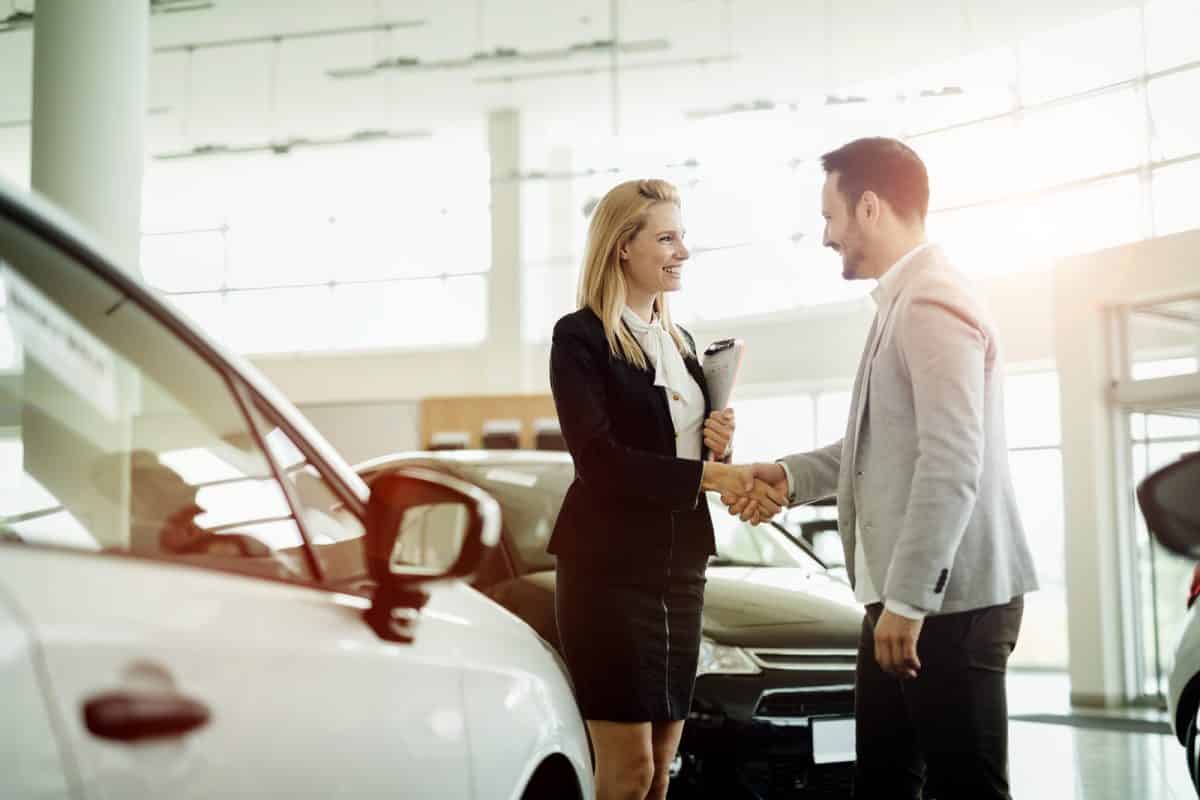 Salesperson selling cars