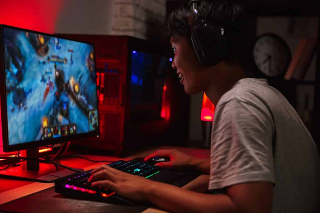 boy playing video games on computer