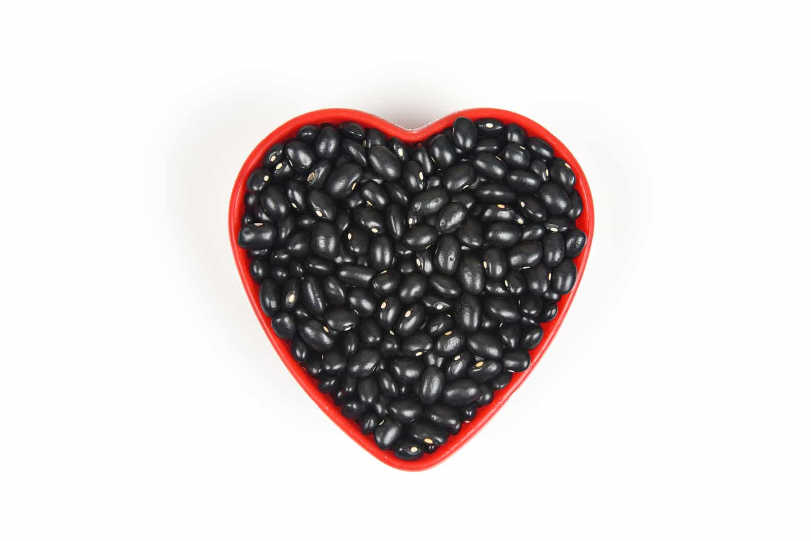 Black beans in red heart plate