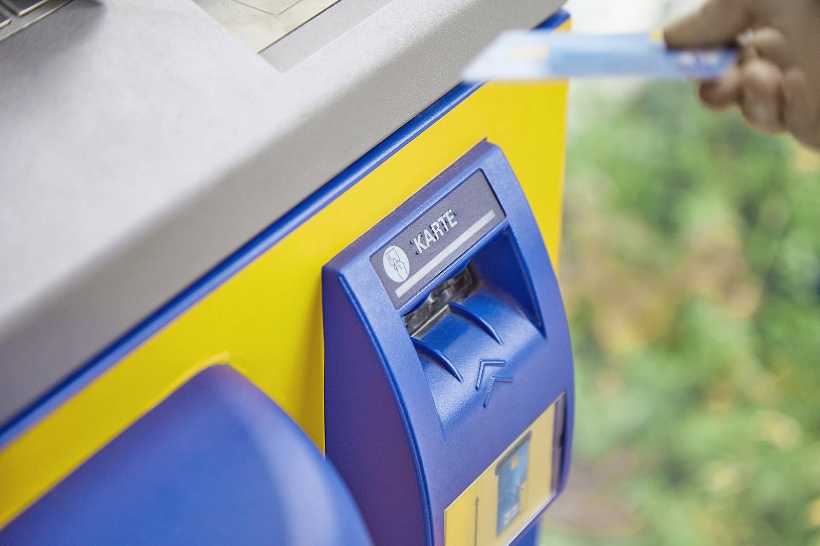 Close-up of an ATM system reading debit and credit bank cards