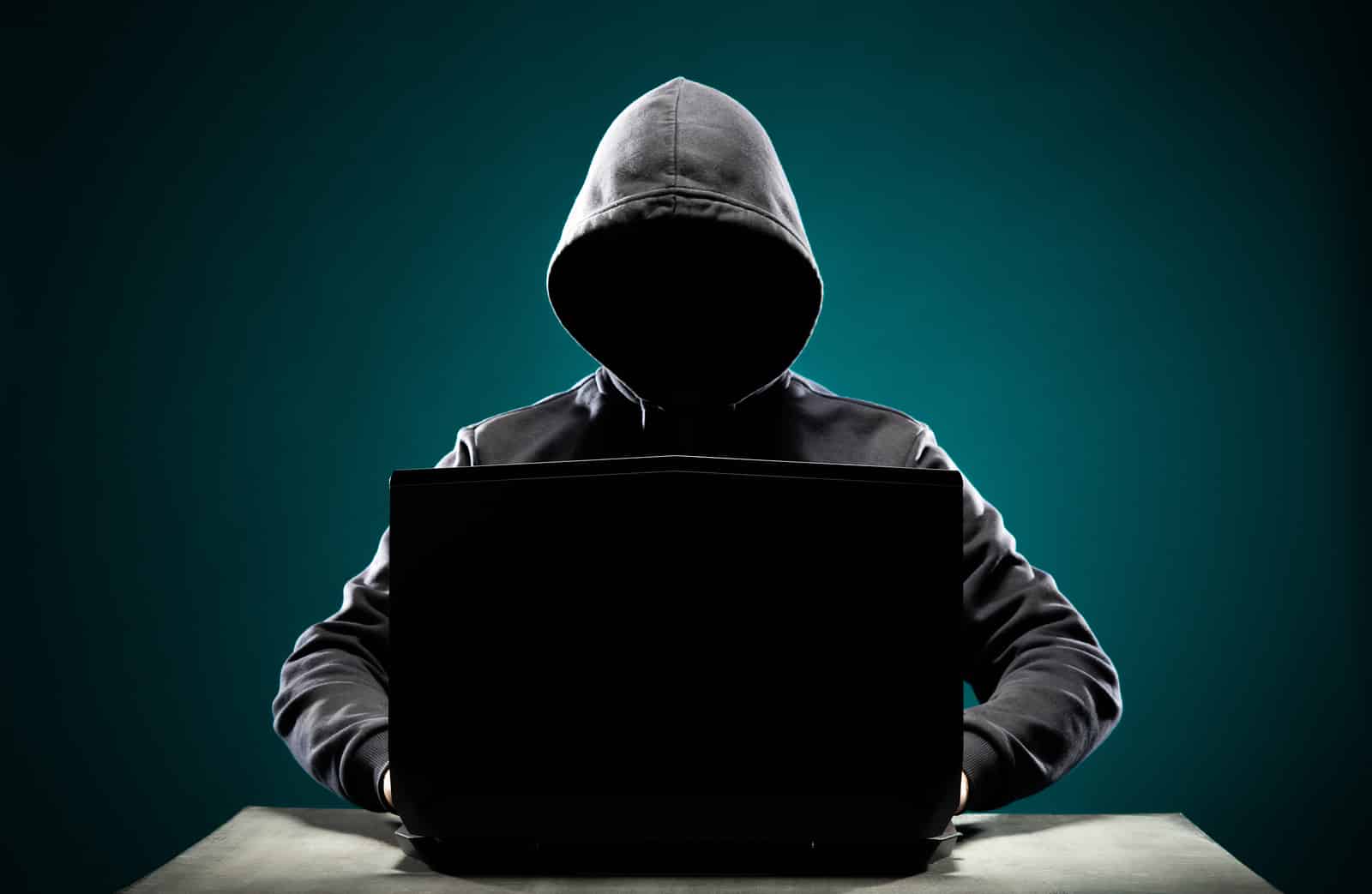 Computer hacker in hoodie.