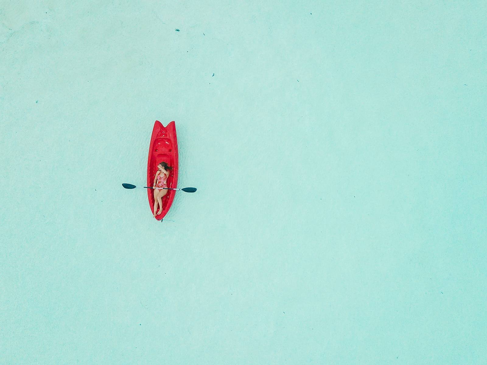 woman kayaking by Astuto Travel