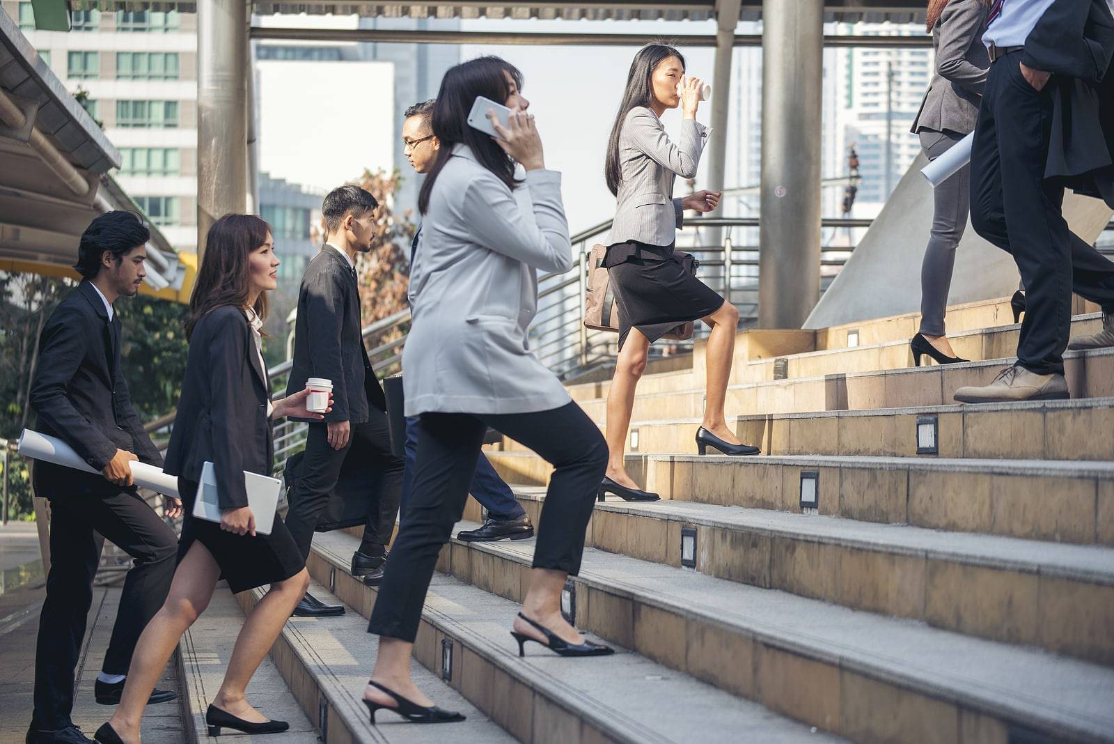 Crowd business people walking step in modern city office