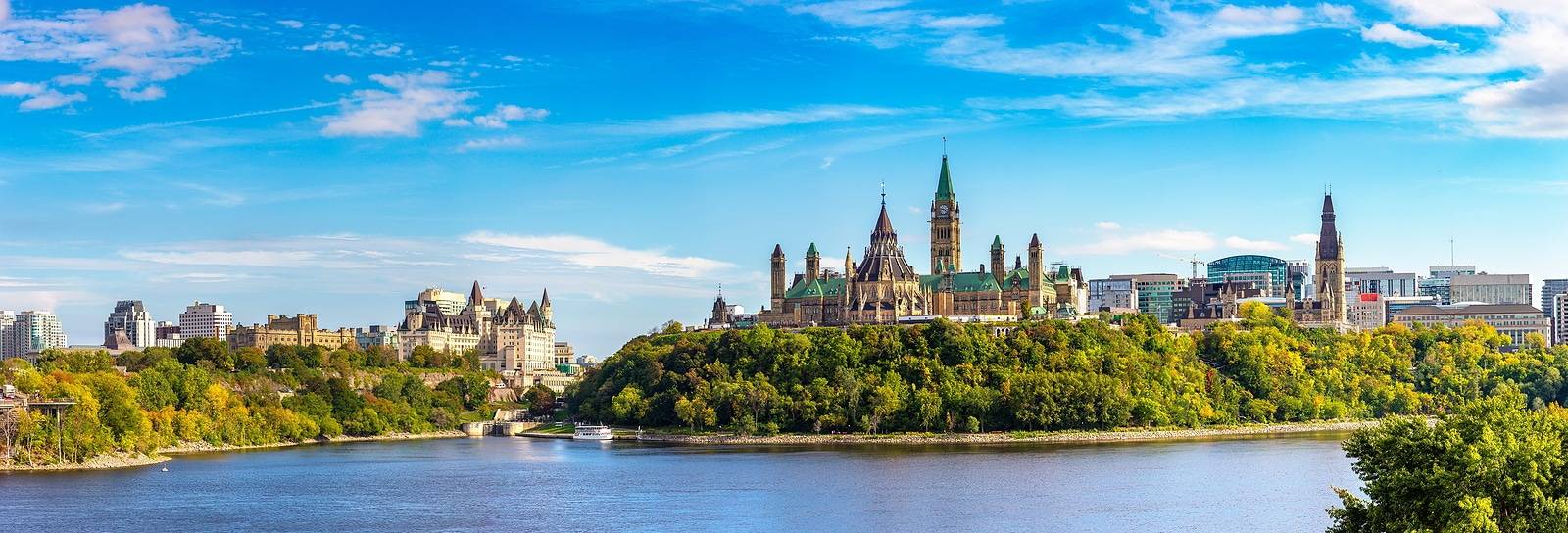 Panorama of Canadian Parliament in Ottawa and river in a sunny day, Canada