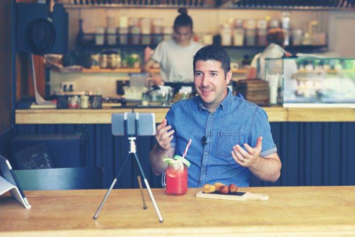 Social Media Influencer Or Food Blogger Creating Content Inside
